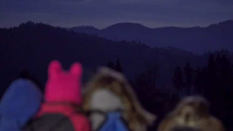Young students look over mountains during Pali night hike